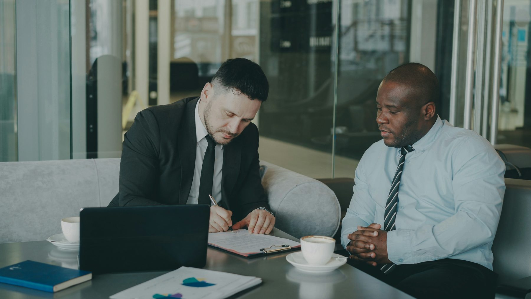 JT Management advisor reviewing performance data with a client